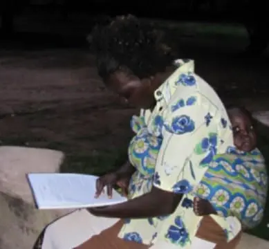 Woman Reading with Baby